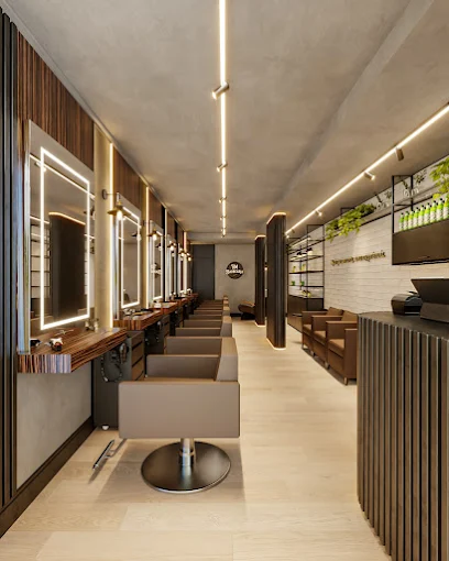 Espaço interno da BM Barbearia — cadeiras e espelhos iluminados